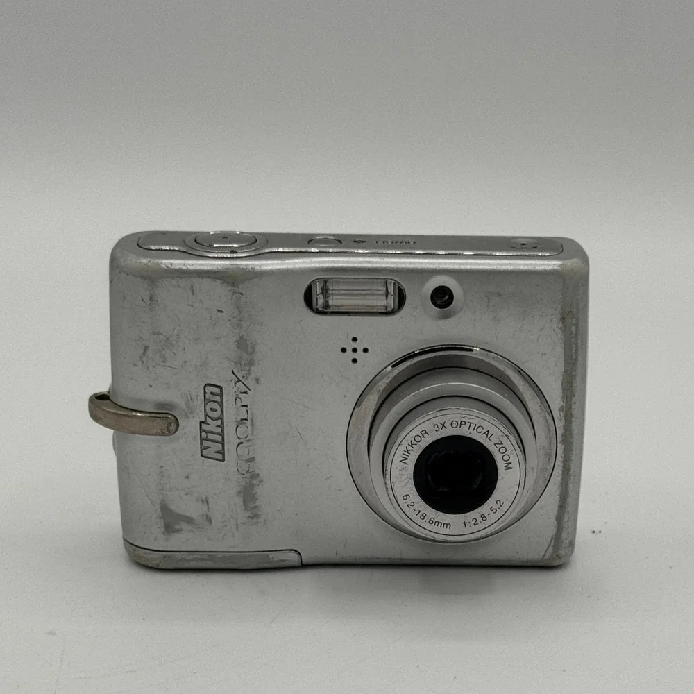 Nikon Coolpix L10 Silver Digital Camera 5.0MP 3x Optical Zoom Bundle Working